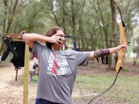 a man holding a bow and arrow