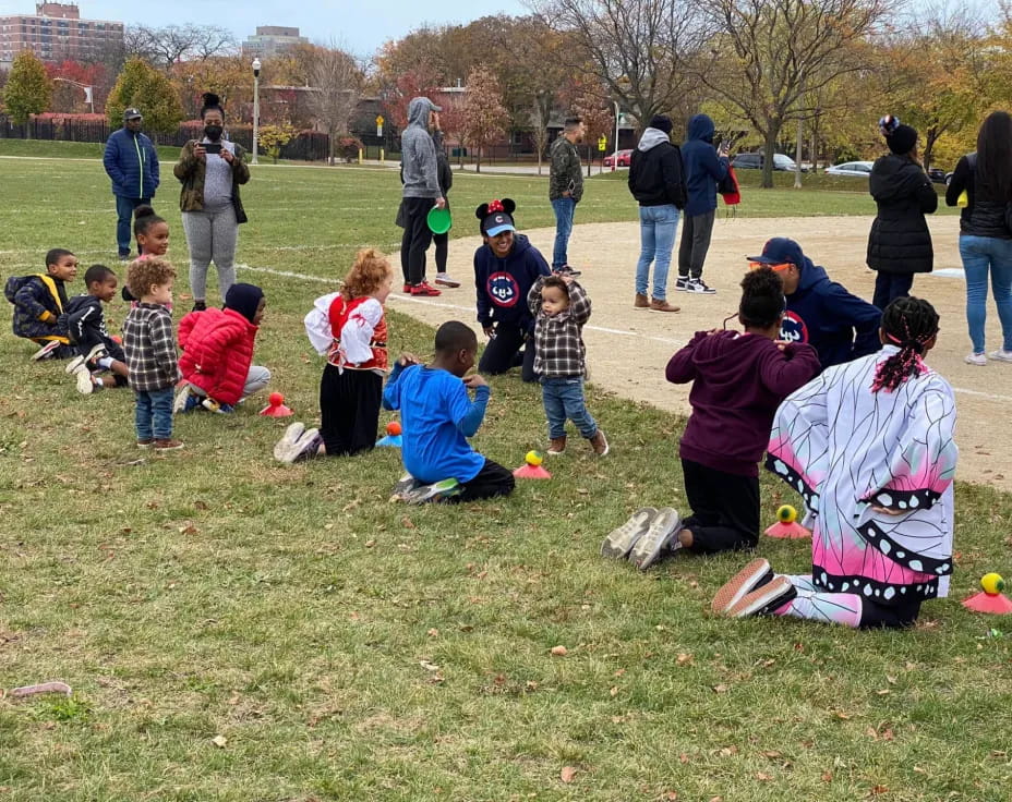 a group of people playing in a park