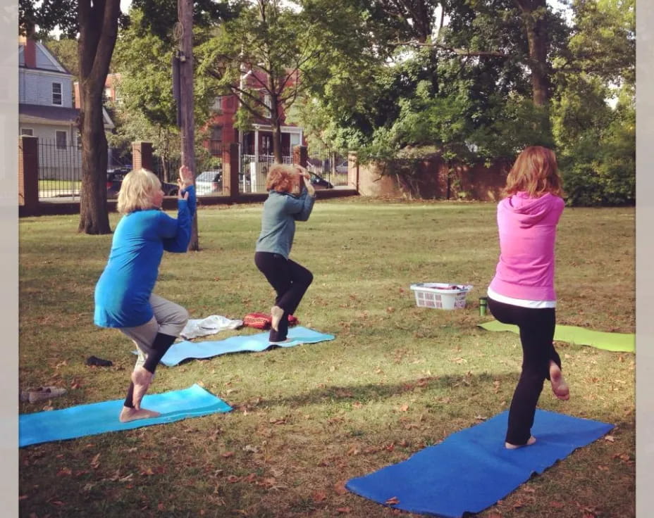 a group of women doing yoga
