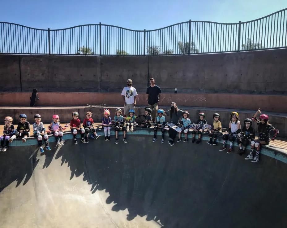 a group of people sitting on a ramp