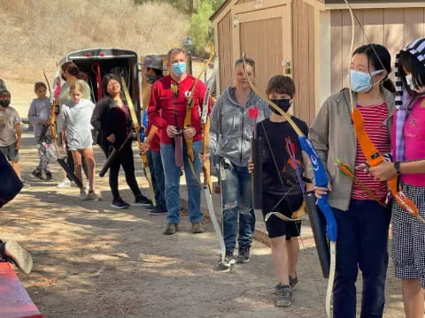 a group of people wearing masks