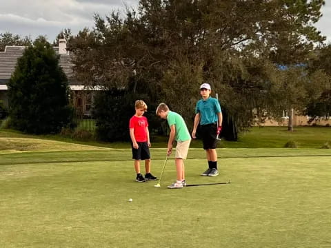 a group of people playing golf
