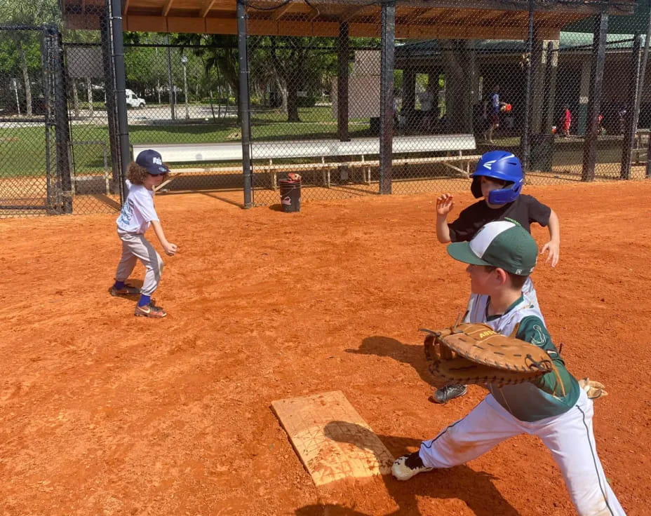 a couple of kids playing baseball