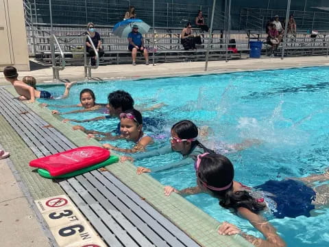 a group of people in a pool