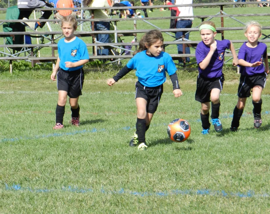 kids playing football on a field