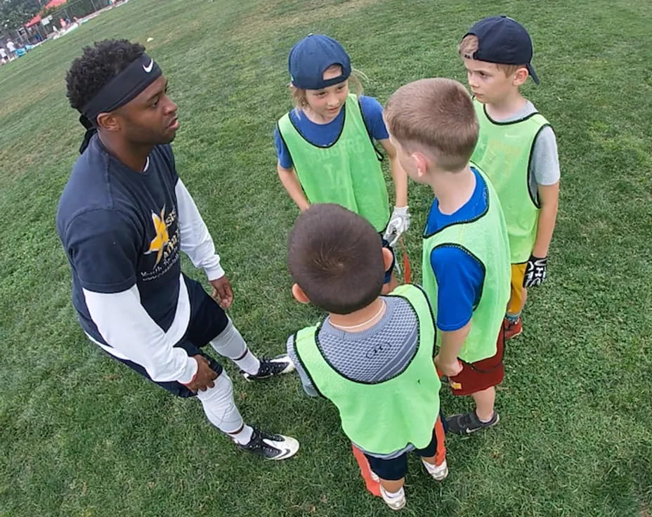 a group of kids in sports uniforms