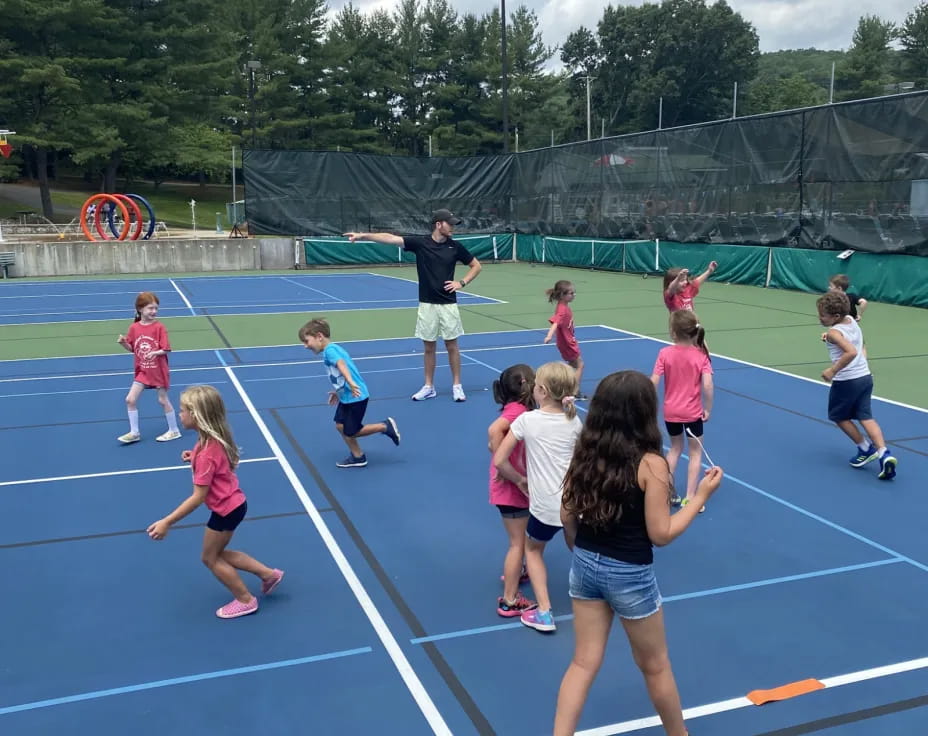 a group of kids playing on a track