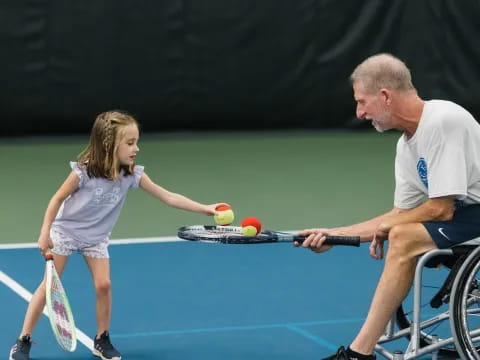 a man and a woman playing tennis