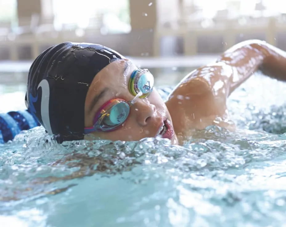 a person swimming in a pool