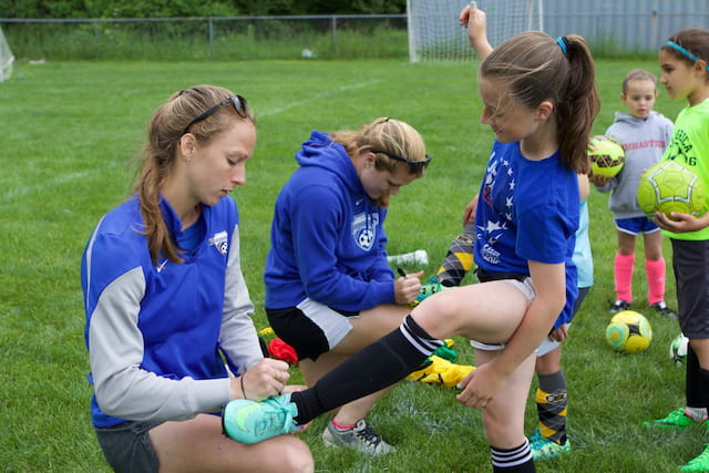 a group of girls playing football