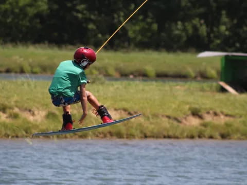 a kid is water skiing