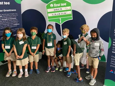 a group of children wearing masks
