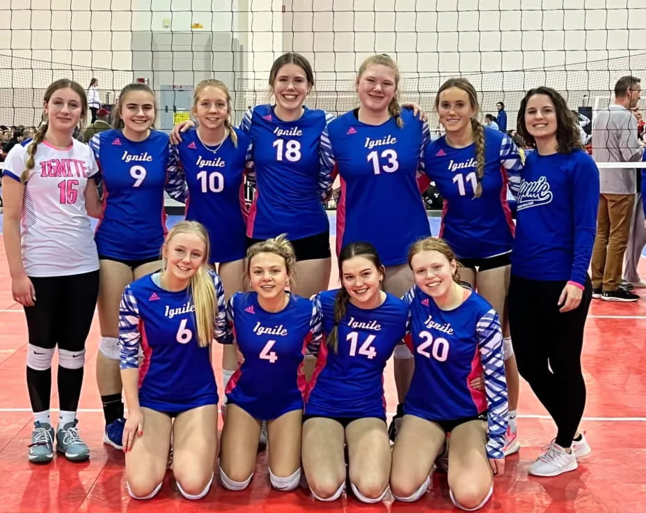 a group of girls in blue uniforms