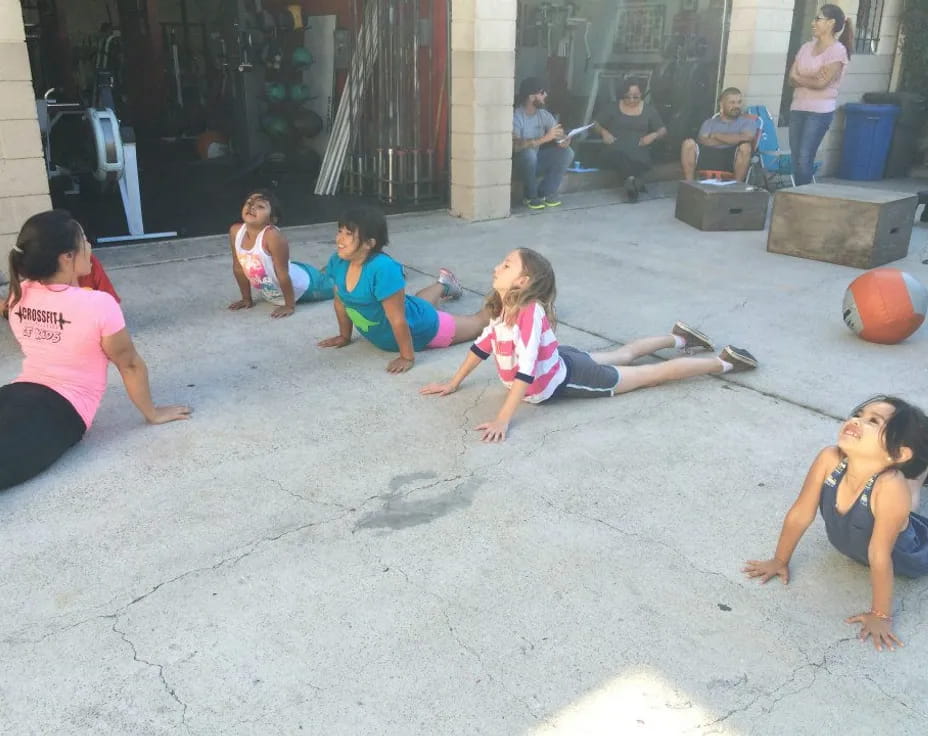 a group of women doing yoga