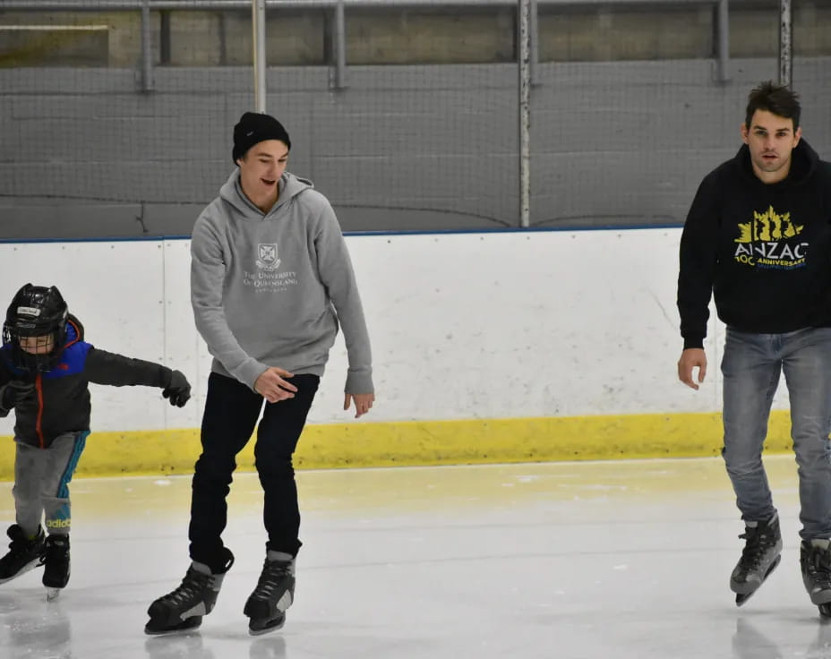 a person and a boy ice skating