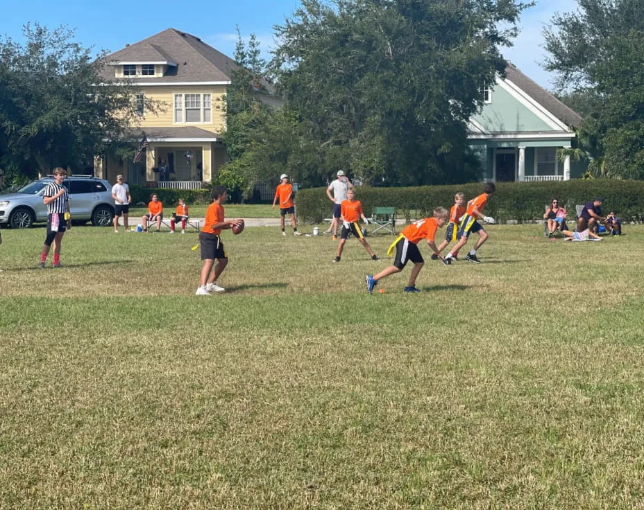 a group of people playing football