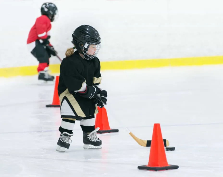 a couple of kids playing hockey