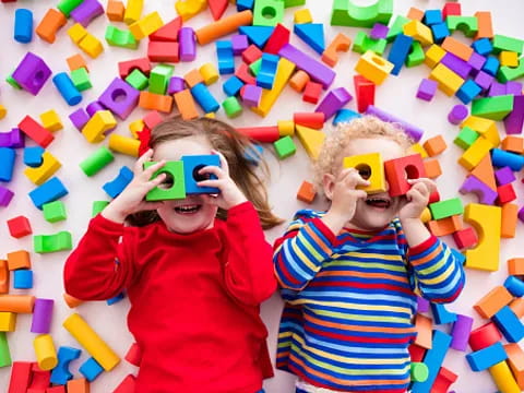 a couple of kids with toys