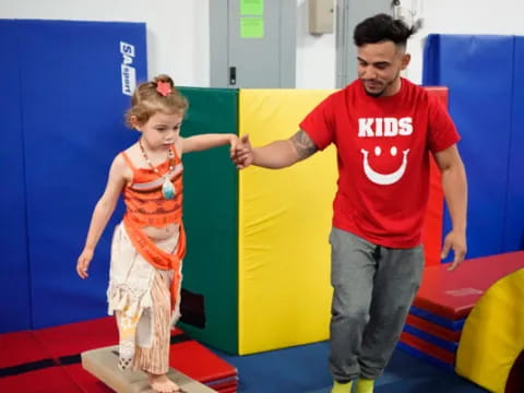 a person and a girl in a room
