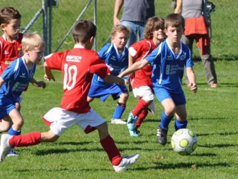 kids playing football on a field