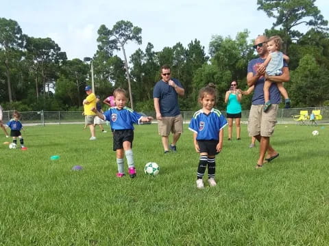 a group of kids playing football