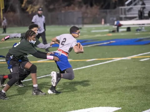 a group of people playing rugby