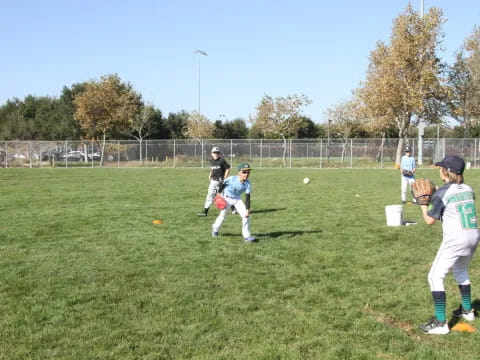 kids playing baseball on a field
