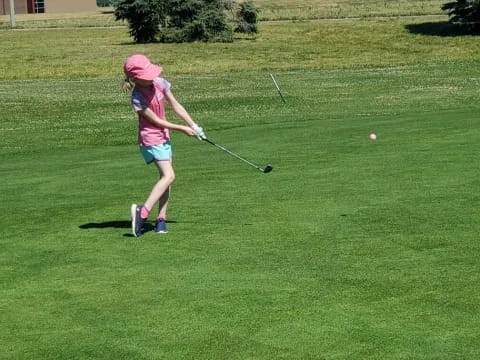 a girl playing golf