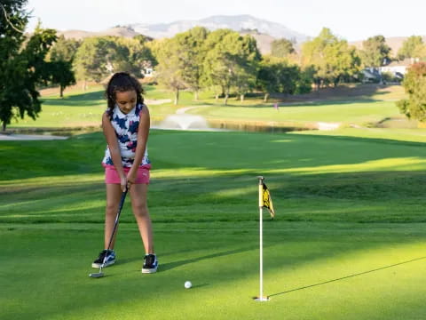 a girl playing golf
