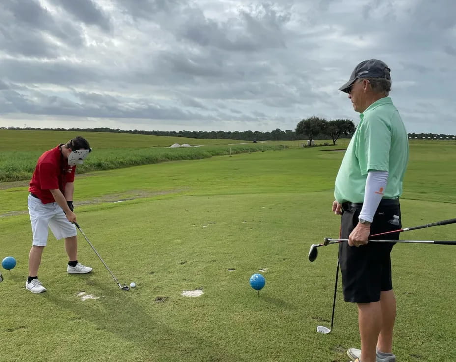 a couple of men playing golf