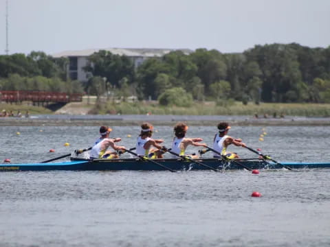 a group of people rowing a boat