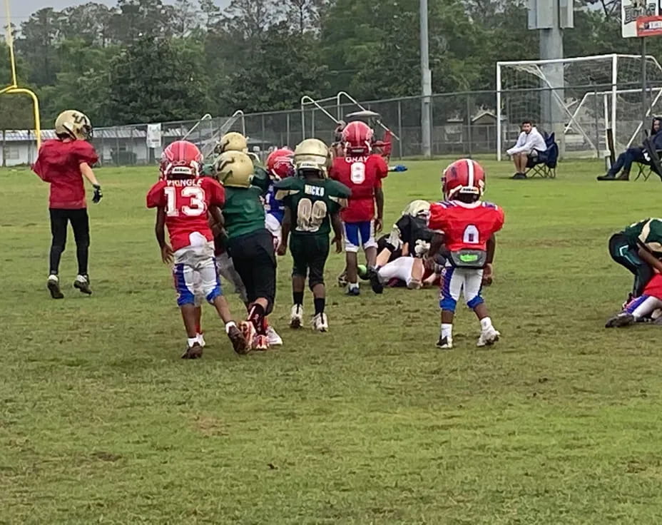 a group of kids playing football