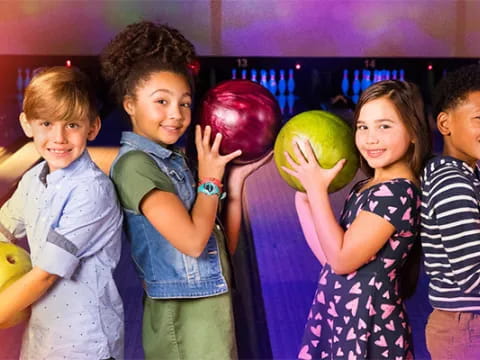 a group of kids holding fruit