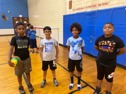 a group of boys holding a ball