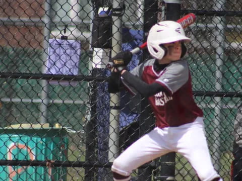 a young boy playing baseball