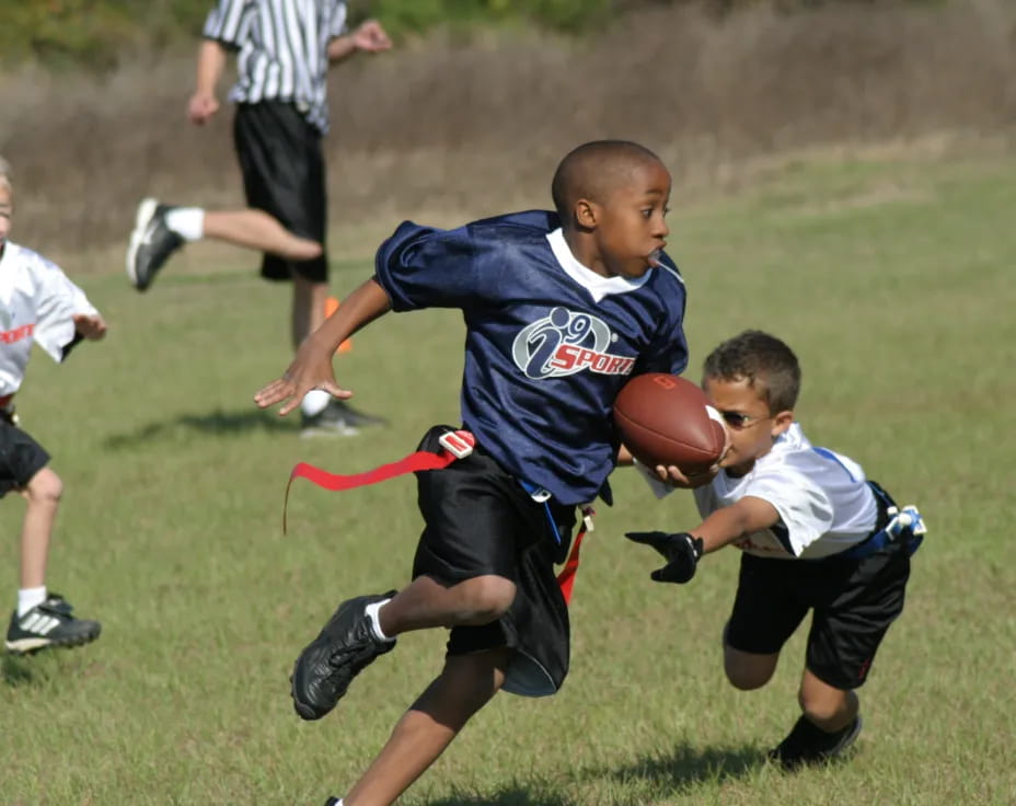 a group of boys playing football