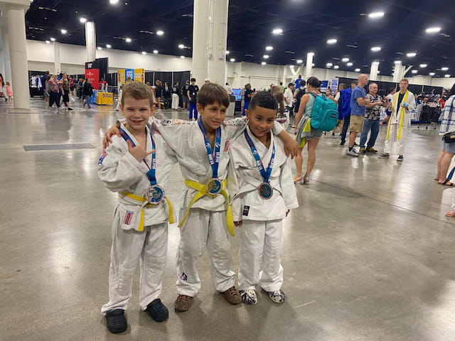 a group of kids wearing karate uniforms