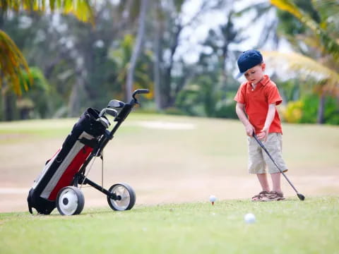 a boy playing golf