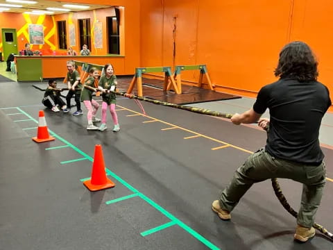 a person playing a game with kids
