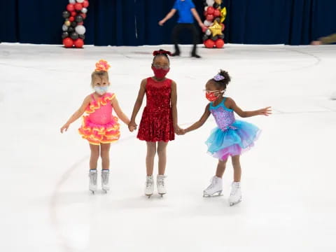 a group of girls ice skating