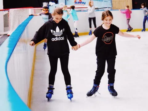 a couple of people on ice skates