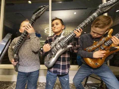 a group of people holding guitars