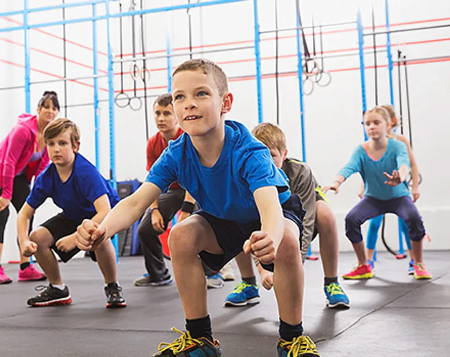 a group of kids in a gym