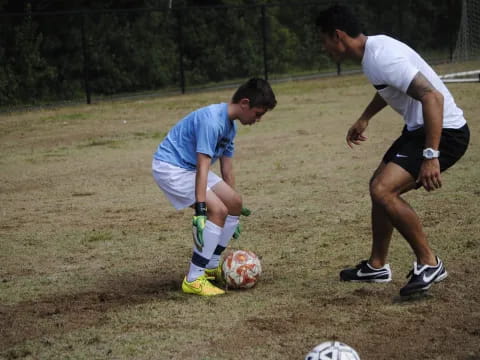 a couple of men playing football
