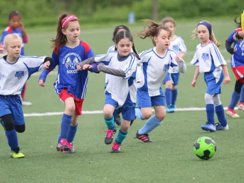 a group of girls playing football