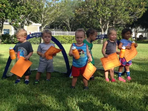 a group of children holding toys