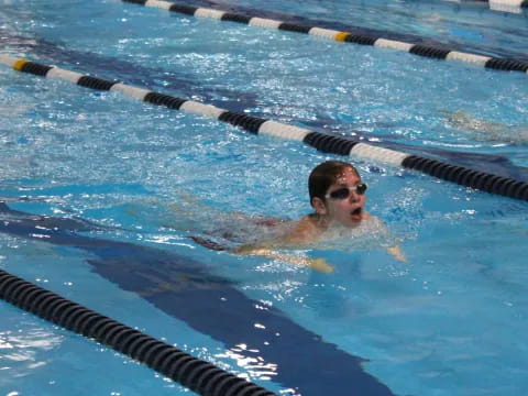 a person swimming in a pool