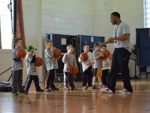 a man talking to kids