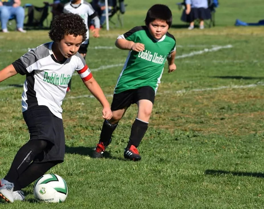 kids playing football on a field