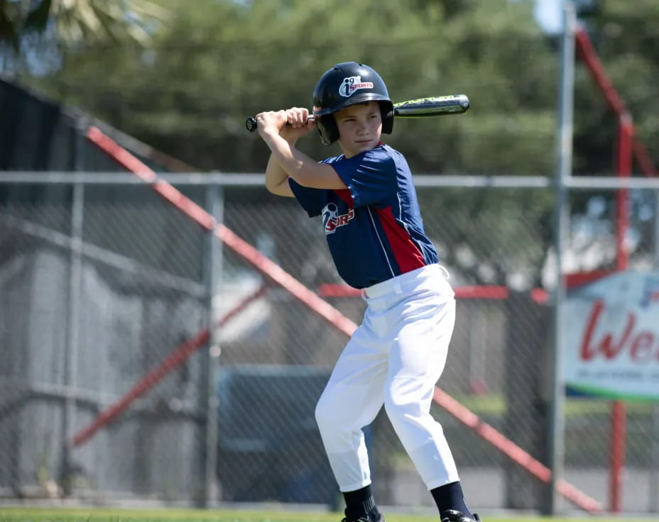 a young boy playing baseball
